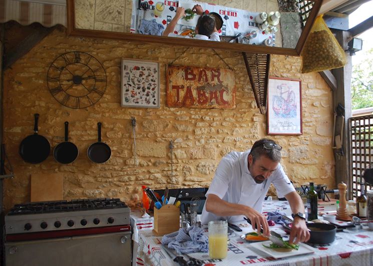 Chef Ian plating the main course at Le Chèvrefeuille