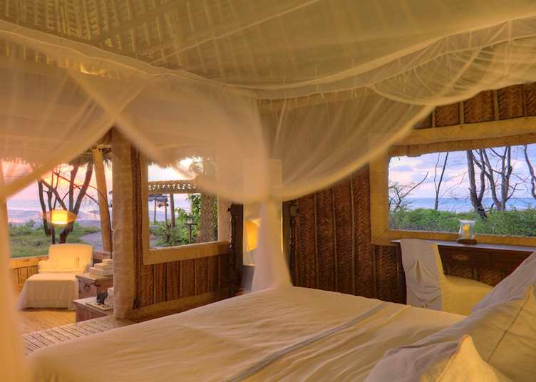 Banda bedroom, Mnemba Island Lodge, Tanzania