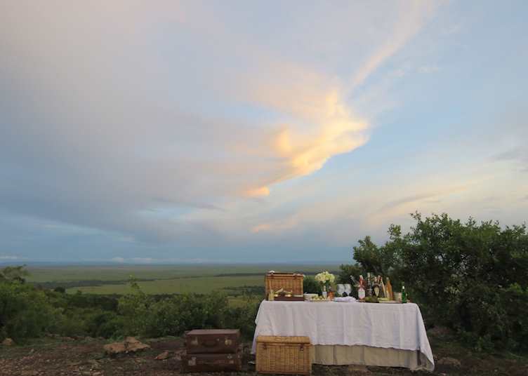 Sundowners looking over the Masai Mara from Bateleur Camp 
