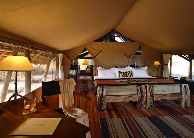 Dhow wood furniture in a tent at Jongomero 