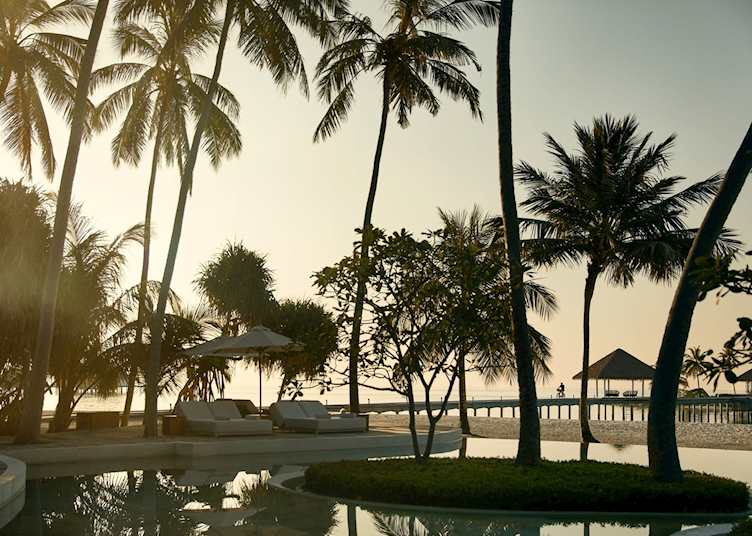 The Madi Deck swimming pool at sunset, COMO Maalifushi