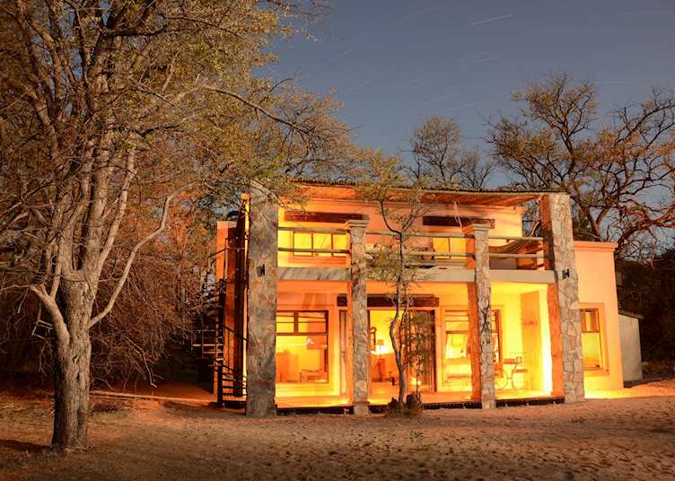 Exterior view at night, Camelthorn Lodge