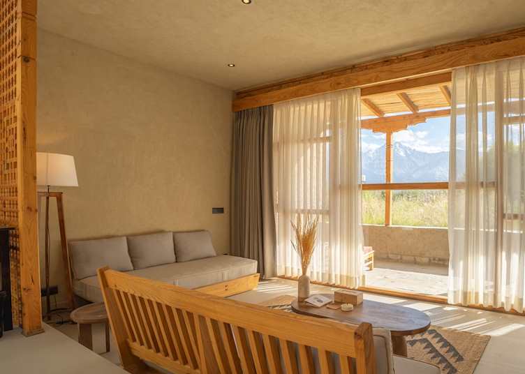 A lounge in the bedroom at Kyagar offering spectacular mountain views