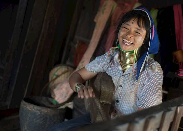 A Padaung girl shares a song and a joke, Loikaw, Myanmar