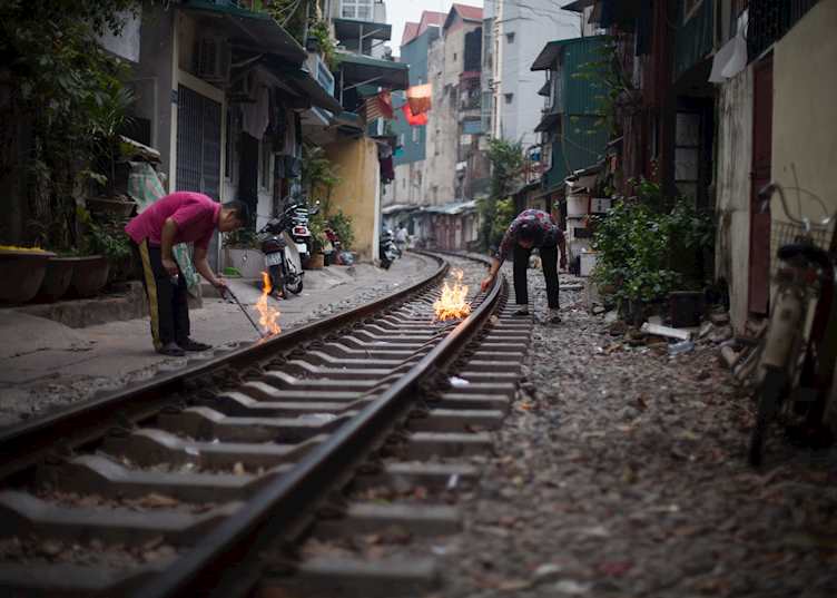 Hanoi locals burning fake money in celebration of Tet