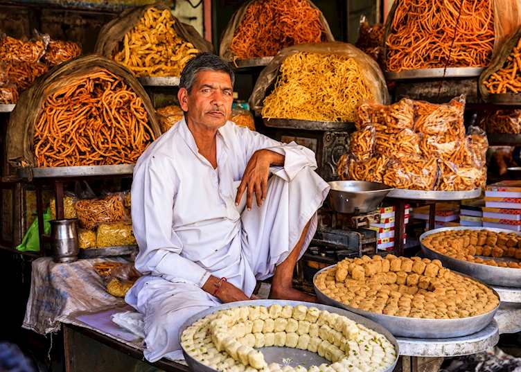 Indian street vendor selling sweets near Jaipur, India