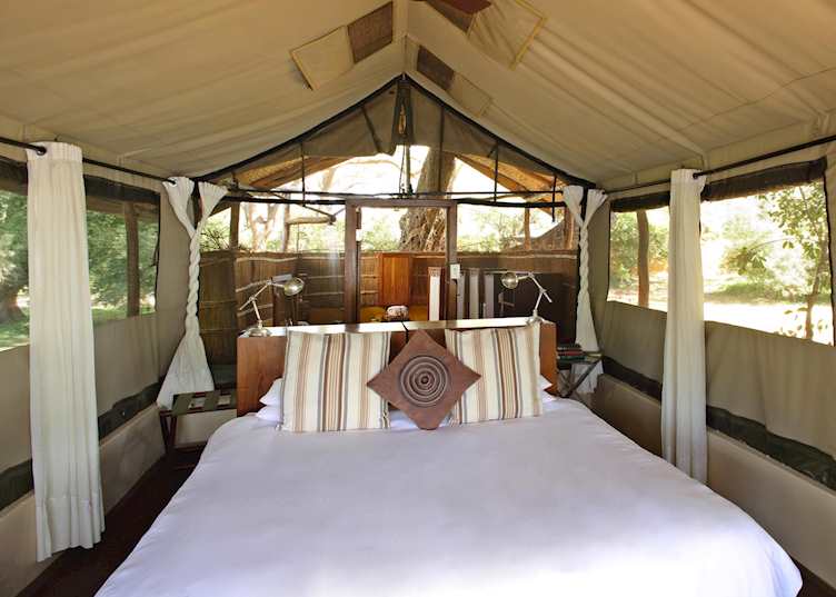 Canvas tents with an open air bathroom, Chongwe River Camp