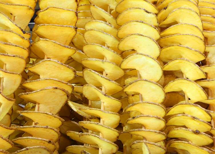 Sliced fried potato skewers