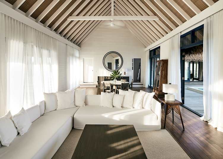 A water villa living room at COMO Cocoa Island