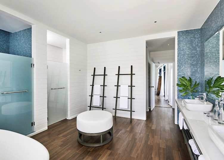 A bathroom of a water villa at COMO Cocoa Island