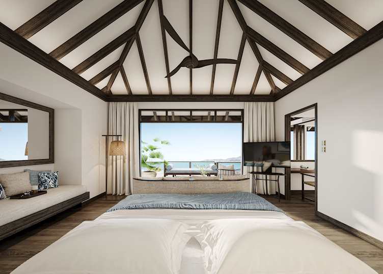 The bedroom of a Deluxe Over Water Villa, Anantara Veli Maldives Resort 
