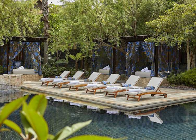 Poolside lounges and cabanas at One Only Cape Town