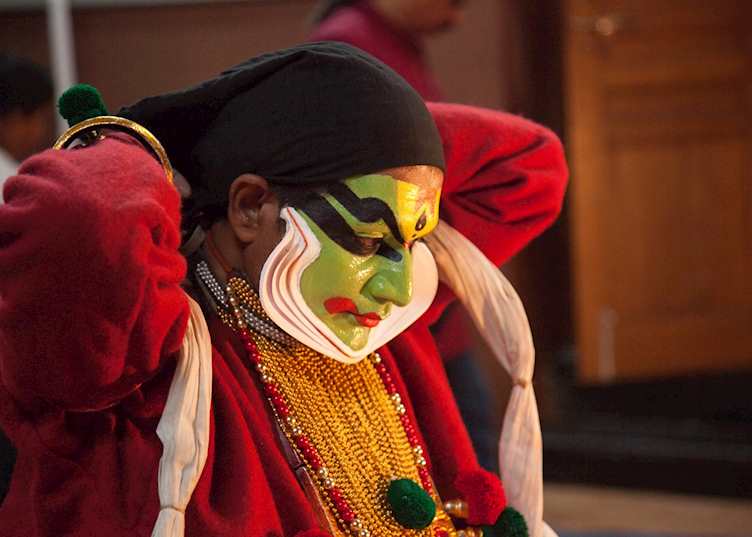 Kathakali performer preparing for a show