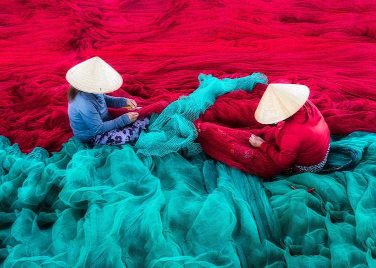 Women knitting fishing nets at Hon Ro, Nha Trang
