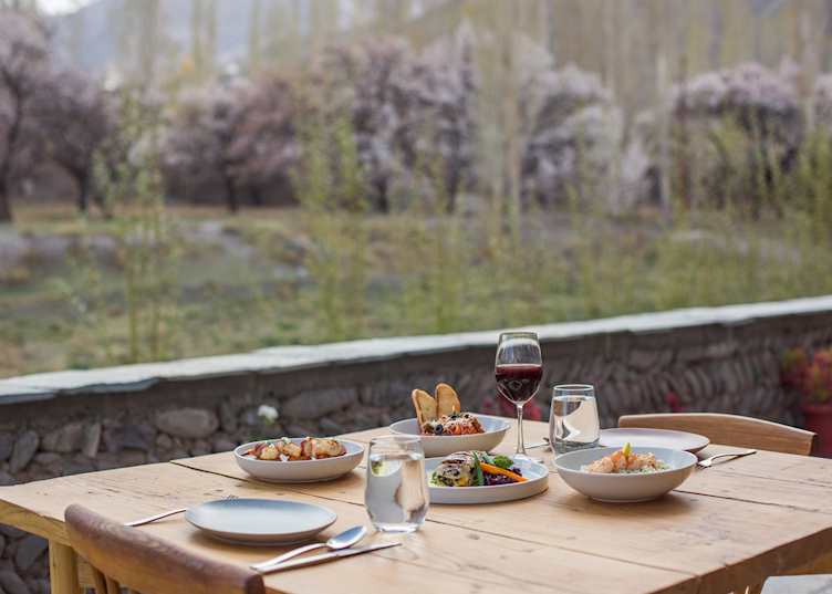 Enjoy meals with views of the apricot orchards whilst at Chulli Bagh