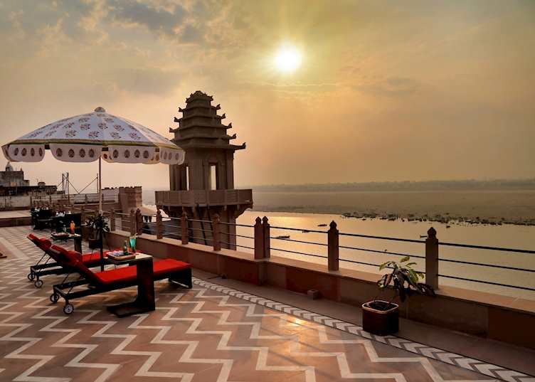 A peaceful terrace at Brijrama Palace offering views of the Ganges 