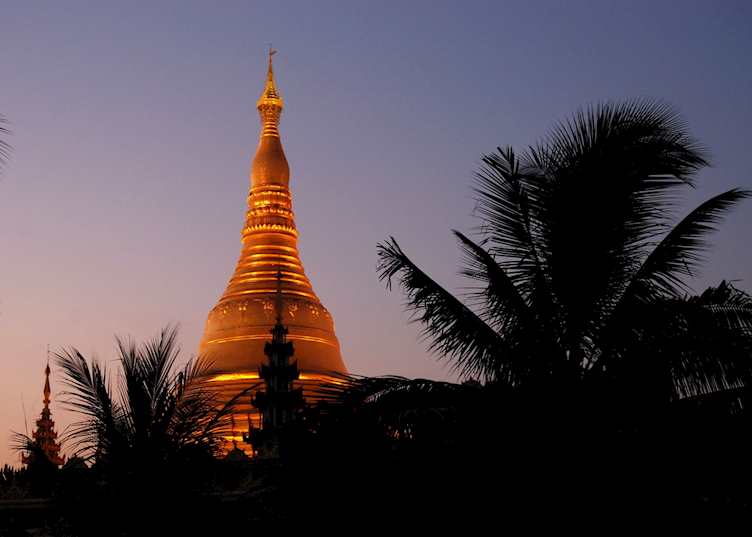 The Shwedagon Pagoda shines bright at sunset