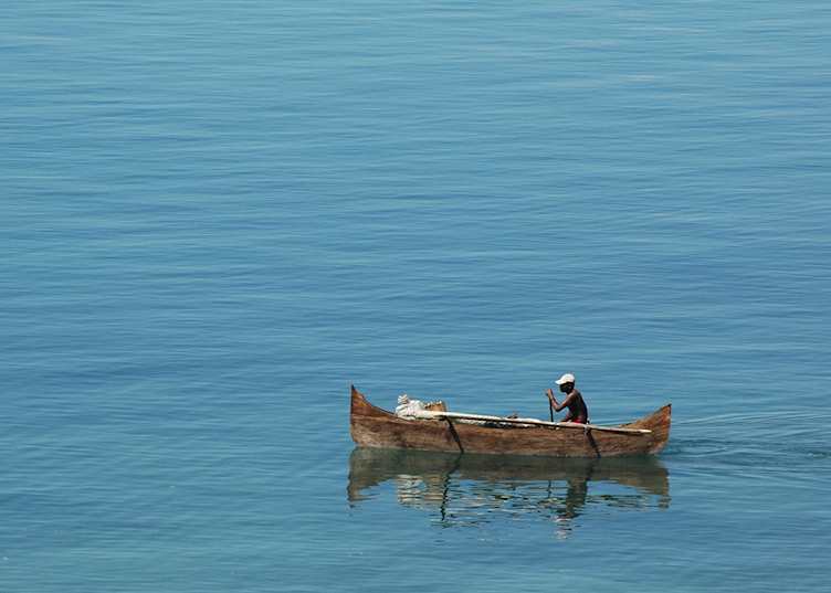 Fisherman in a pirogue off Nosy Komba