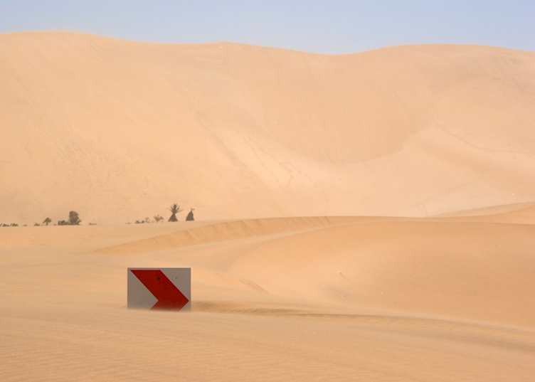 Drifting sand dunes near Lüderitz bury everything in their path