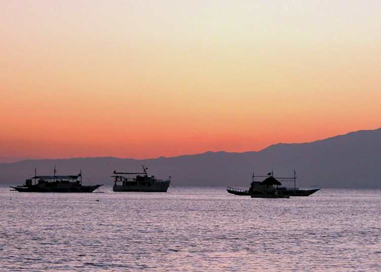 The sun setting behind Negros as seen from Siquijor, Philippines