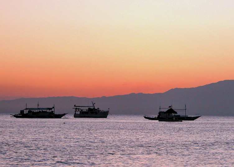 View of the sunset from the beach, Coco Grove Beach Resort, Siquijor