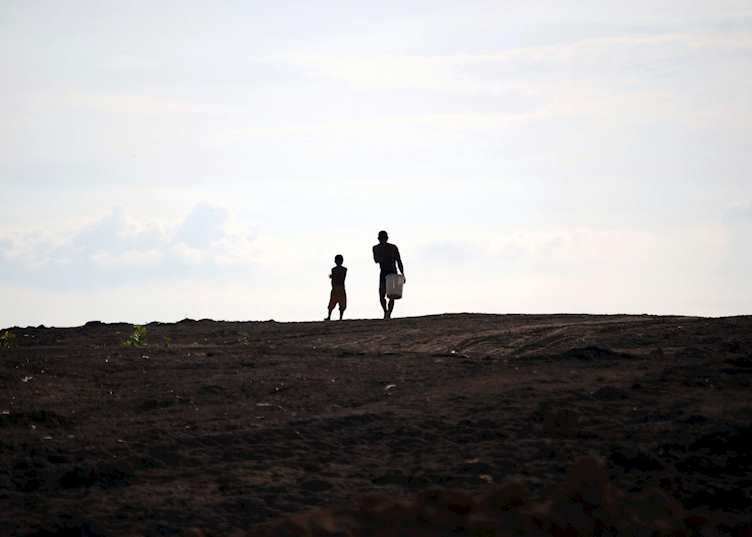Father and son heading home - Tonle Sap