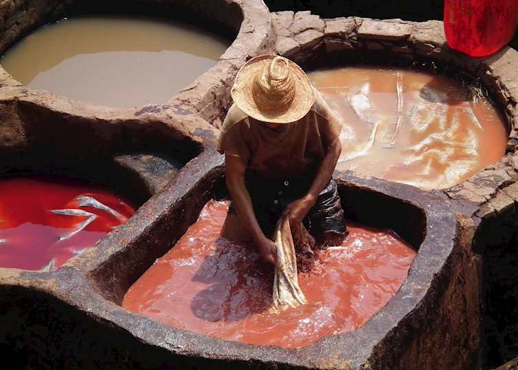 Man working at a leather tannery, Fez, Morocco