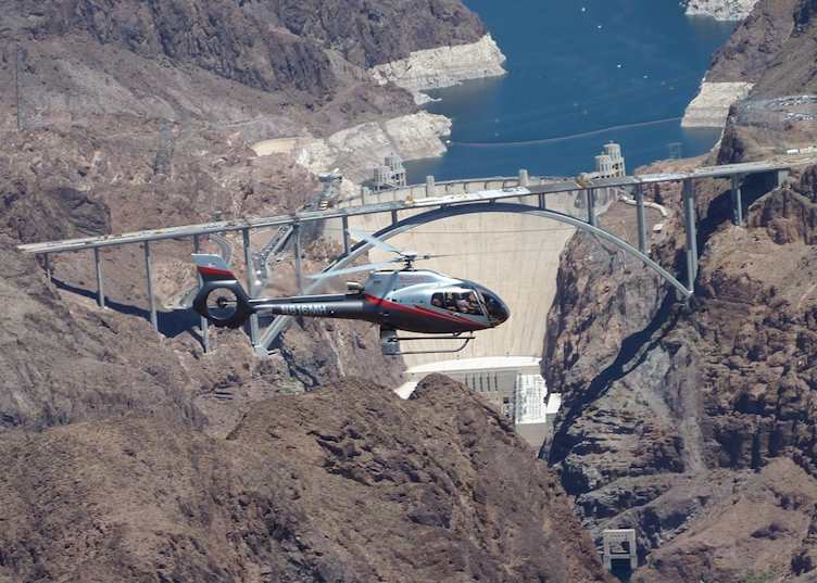 A helicopter over the Hoover Dam