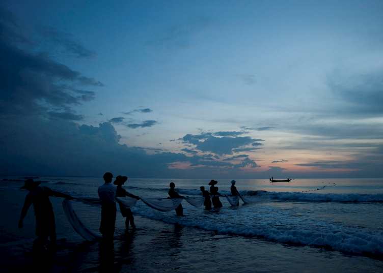 Bringing in the fishing nets, Ngwe Saung beach, Myanmar