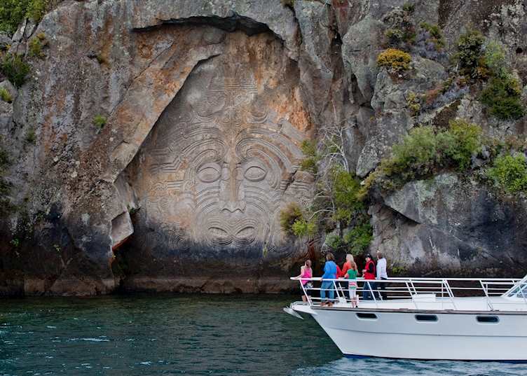 Admiring Lake Taupo's Maori rock carvings