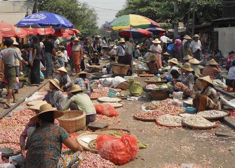 Traders with their wares on the tracks at Mandalay Railway Bazaar