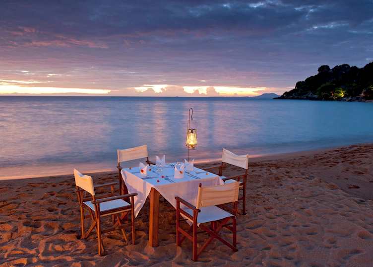 Dine on the beach at Kaya Mawa, Likoma Island