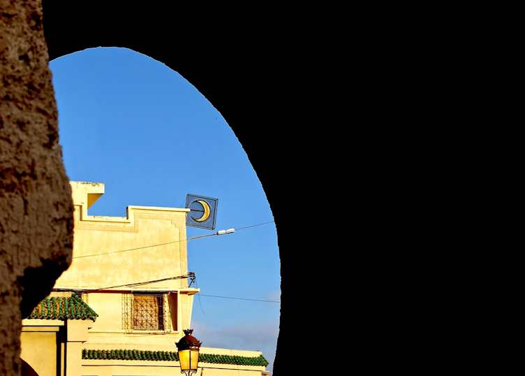 Crescent sign through archway