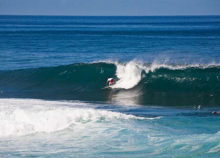 Surfer, North Shore, Oʻahu (Source: HTA / Tor Johnson)