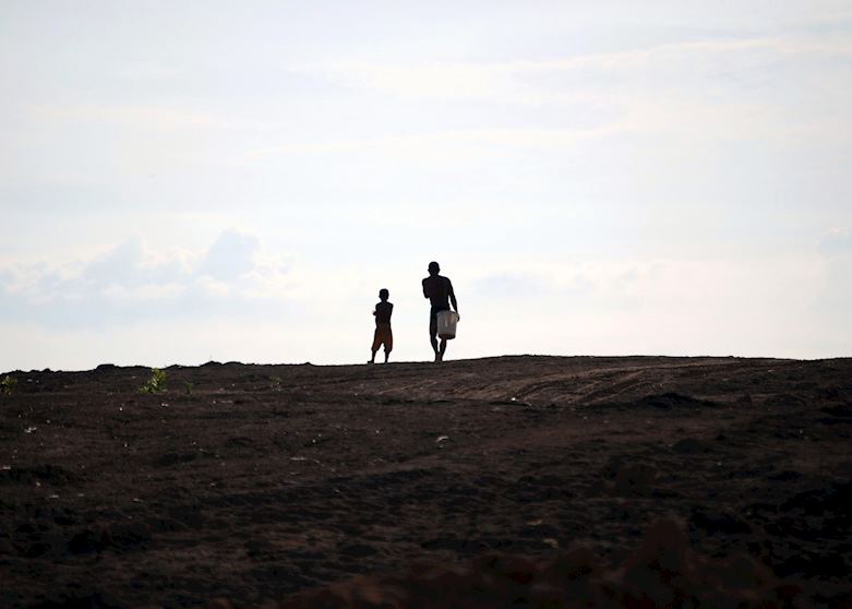 Father and son heading home - Tonle Sap Father and son heading home - Tonle Sap