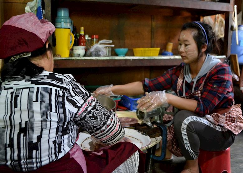 Local artisans preparing the famous Kayah sausage Local artisans preparing the famous Kayah sausage