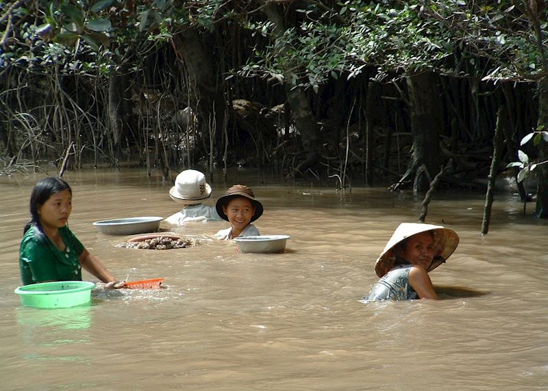 Women washing clothes in the Mekong Delta