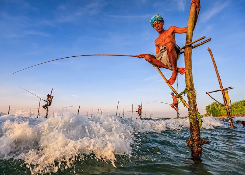 Stilt fishermen on the coast near Galle