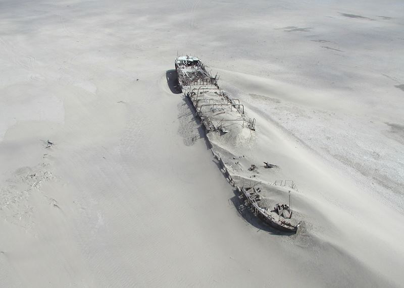 A shipwreck covered by the sand at The Skeleton Coast, Namibia