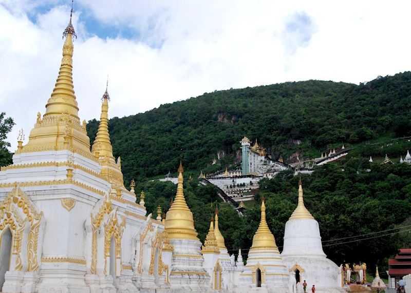 The hillside Pindaya Caves overlook these gloriously ornate stupas