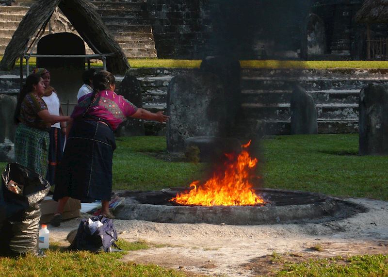 Mayan worship at sunrise in Tikal