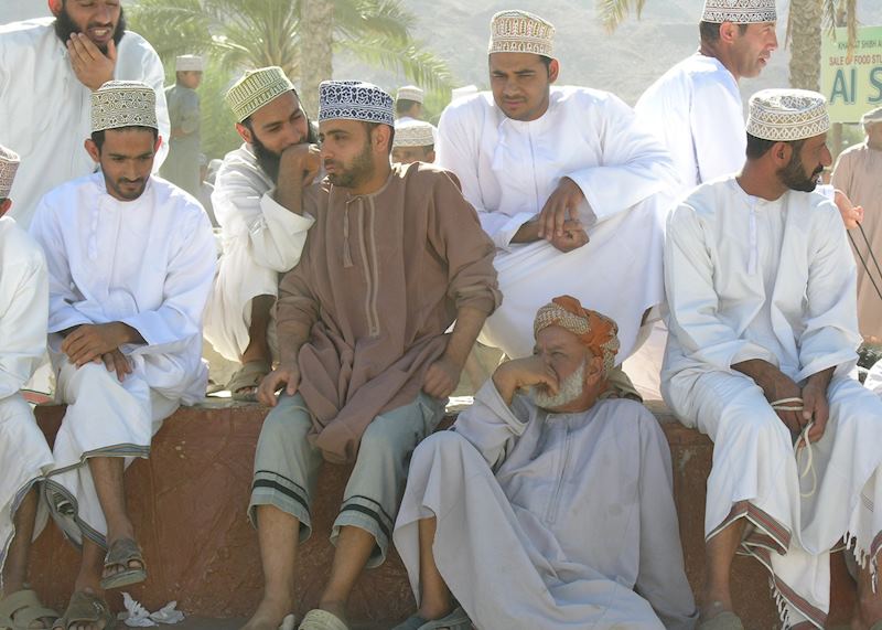 Men at Nizwa cattle market, Oman