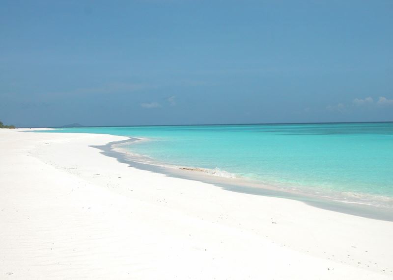 Powder white sand and turquoise sea at the Amanpulo