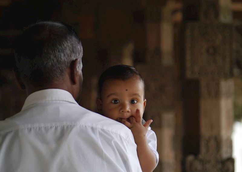 Families bring their babies to the Temple of the Tooth to be blessed, Kandy