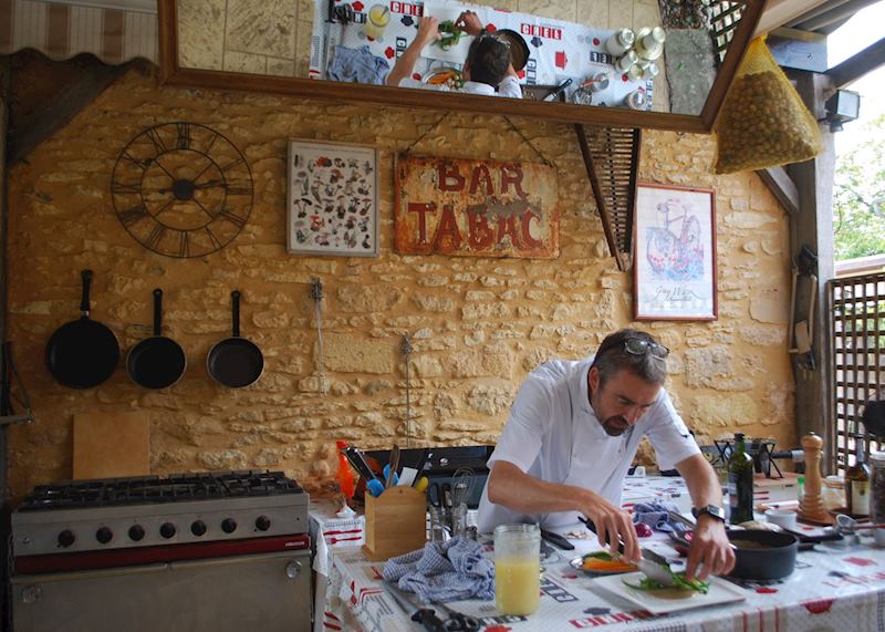 Chef Ian plating the main course at Le Chèvrefeuille