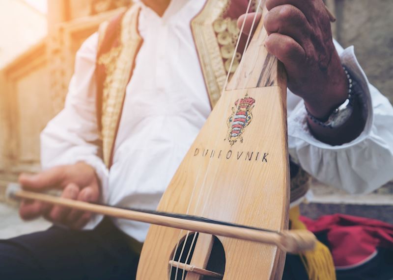 Klapa singer playing mandolin, Dubrovnik