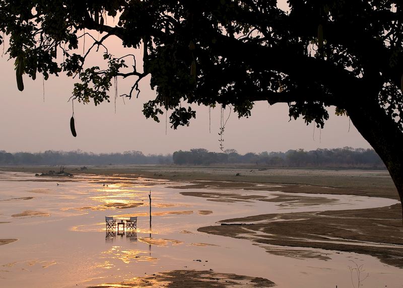 Sundowner drinks in the Kapamba River by the Bushcamp Company